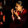 Merchant & Shadow Photo:  A vendor waits for business on a busy street in Kathmandu. 