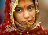 Hindu Bride Photo: A beautiful Indian bride receives blessings from the Ganges river before entering into matrimony.