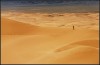 Sand Mountain Photo:  Somewhere in the Gobi desert, a Korean travel-mate stands at the ridge of an impossibly tall sand dune over a valley of smaller sand dunes.  To reach the tops of these sand dunes, requires a surprising amount of stamina.  For every 2 steps forward, one step is lost slipping back down the dune.  I estimated these dunes to be approximately 150-200 meters tall.