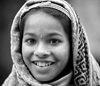 Head Scarf Photo: A local Sikkimese girl pauses for a quick portrait.  Sikkim is situated in the northeast corner of India but more importantly, within the swath of Buddhist land bordering southern Tibet where the Asian and Indian divide is evident in the diverse ethnic makeup its people. 