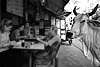 Table For One? Photo: Street-side restaurant in Paharganj.  The regular foreign customers don't even bat an eyelash at the occasional bovine beggar.  This particular cow comes by at least twice a day for handouts from the restaurant proprietors.  She doesn't leave until she gets a snack so, ultimately, she gets her way.