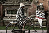 Up Headlight Photo: Panning photo of a Balinese cyclist in front of the National Palace in Ubud.