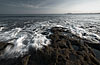 Encroaching Waves Photo: Small natural pools are slowly filled by the rising tide.