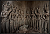 Hand Polished  (Angkor Wat Temples Part II) Photo: Carved apsaras in a corner of one of the temples at the Angkor Wat complex.  The apsaras display the unfortunate wear from tourists' wandering hands.