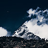 Thermals (Machapuchre Part I) Photo: A paraglider drifts in the sky with the Himalayan mountain, Machapuchre, for a backdrop.  The photo was taken from the valley in Pokhara.