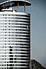 Building & Reflection Photo: Tall modern building in Guiyang, typical architecture of all major Chinese cities.  Old hutongs (narrow alley neighborhoods) are often razed in the name of modernizing China.