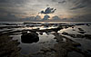 Pools Photo: Low tide leaves pools of seawater and trapped fish.