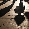 Shadows (The Barkhor I) Photo: Tibetans stroll down an old alley in the religious heart of Lhasa.