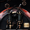 Coal Maw (Toy Steam Train III) Photo: A locomotive engineer drops an evenly distributed amount of coal into the lower doors which converts water to steam, giving the narrow gauge train power enough to tackle the Darjeeling hillside.