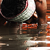 Dig & Scoop Photo: A local man fishes for change at the bottom of the Ganges river.