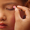 Pink on Pink Photo: Young Miao ethnic minority dancers apply makeup before a performance.