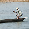 Day At The Office Photo: A crocodile lurks while the locals go about their daily business.