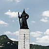 The Admiral Photo: Downtown Seoul, very near Seoul city hall.  Summer is full of activity at the base of the statue of Admiral Yi Sun Sin (이순신).  As far as I'm concerned, this is the cultural heart of the city.  There seems to be something different planned in this area for every night of the summer, thankfully, giving bored locals and tourists something to do that doesn't involve a television set and perfectly groomed Korean drama stars.