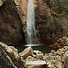 Silk Falls Photo: The sunset's glow bathes the western face of a nearby peak at Seoraksan (소락산).  You can see by the leaves that they are on the cusp of achieving autumn cliche status.  When the leaves finally change colors, Seoraksan is overflowing with more professionally geared trekkers than Everest base camp.