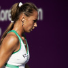 Leggy Photo: Women's professional tennis player, Magdalena Rybarikova from Slovakia goes for a towel during an early round match at the Hansol Open.