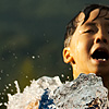 Summer Wind Photo: Young boys muck around in the fountain (previously featured here and here) near the Yi Sun Shin statue in downtown Seoul.