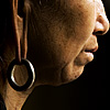 Doughy Lobe Photo: A Miao ethnic minority woman stares out a doorway.