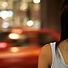 Shared Glance Photo: A Thai woman waits for her bus.