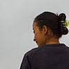 Mountain Request Photo: An ethnic Tibetan woman rises after kneeling to pray to holy Meili Snow Mountain.