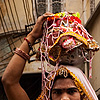 Pot Head Photo: A man dressed as a woman stands amid cycle traffic.