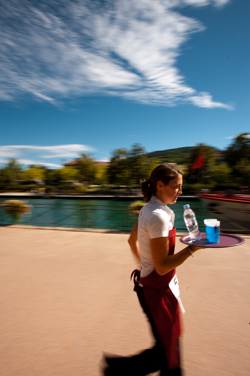 Cute waitress hamming for the camera nearly drops her drinks at the Waiter's Run - Annecy, Haute-Savoie, France - Daily Travel Photos