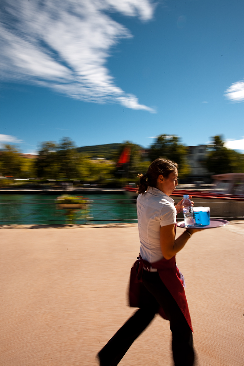 Cute waitress hamming for the camera nearly drops her drinks at the Waiter's Run - Annecy, Haute-Savoie, France - Daily Travel Photos