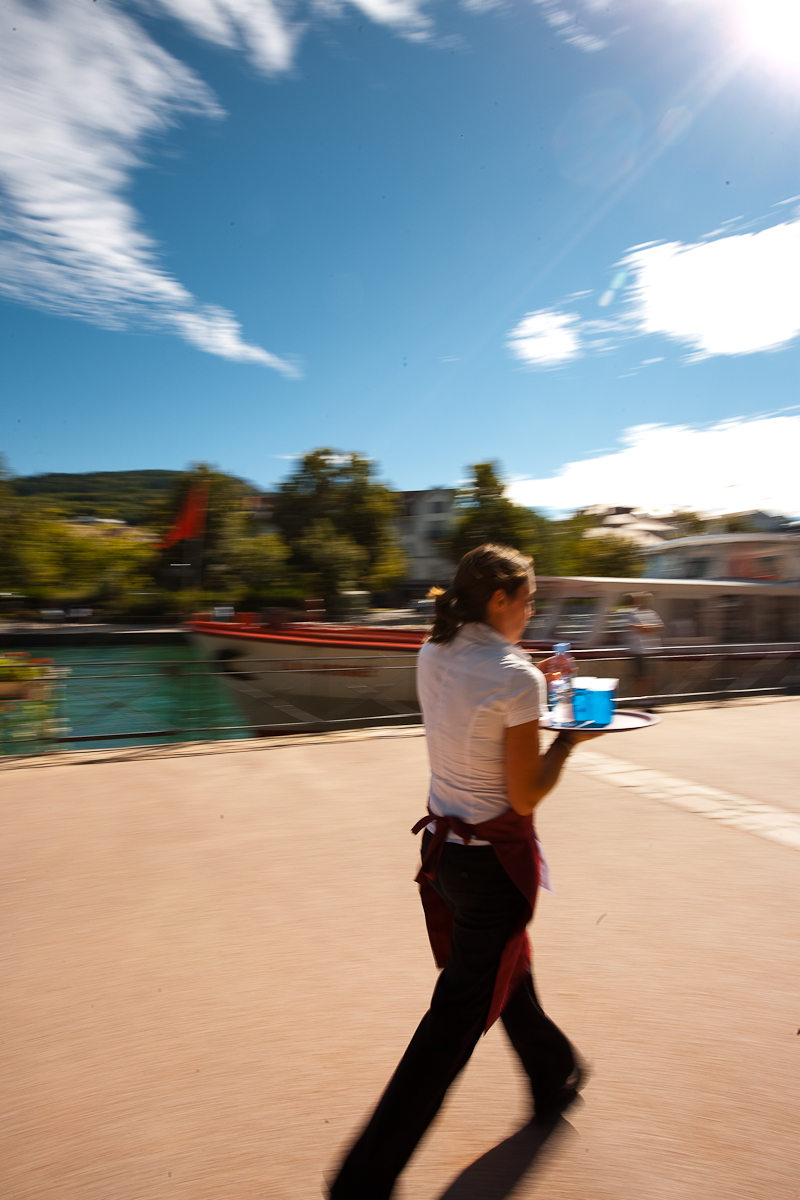 Cute waitress hamming for the camera nearly drops her drinks at the Waiter's Run - Annecy, Haute-Savoie, France - Daily Travel Photos