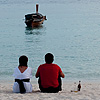 The Throw Photo: A Spanish couple enjoys an evening of drinks overlooking the ocean.