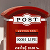 Letter Box Photo: A young Swedish girl takes a morning walk holding a delicious and possibly hot beverage.