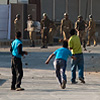 "Paradise On Earth" Photo: A Kashmiri golfer hits the links.  Youths throw stones at the Indian military.