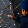 Wizards of Whirl Photo: A young Sikh showman shows off his martial arts skills with a net-like weapon at the Paonta Sahib gurudwara.