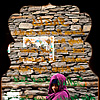 Cold Cutie Photo: A cloaked Indian girl walks outside of a tourist cafe. 