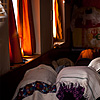 Wrapped Worship Photo: Buddhists pray inside a natural-light only monastery.