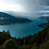 Stormy Recreation Photo: A paraglider braves storm clouds for a fly in the sky over Annecy Lake.