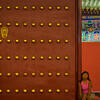 Great Gate Photo: A Chinese girl shows the relative size of the entry gate at the Temple of Heaven in Beijing (ARCHIVED PHOTO on the weekends - originally photographed 2007/08/05).