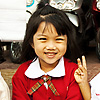 Tiny Thais Photo: A group of happy little Thai chickens wait for a parade on a curb.