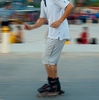 Vientiane Evening Recreation Photo: A moving pan of a Laotian inline-skater on the promenade at sundown in Vientiane.