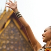 Sonkran Steppin' Photo: A beautiful Thai woman performs a unique dance originating from northern Thailand for Songkran at Wat Pho temple.