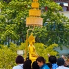 Songkran Revered Statue Photo: The holy Phra Puttha Sihing Buddha statue is bathed and perfumed at city hall in Bangkok for Songkran.