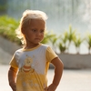 Li'l Fashion Model Photo: A young tourist girl unleashes impromptu runway modeling outside the Paragon Mall in Bangkok.