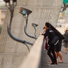 Cables 'n Concrete Photo: Thais watch the sunset on the pedestrian walkway of the deck of the Rama VIII bridge in Bangkok.