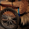 Pedaling Peddler Photo: A door-to-door bicycling brush, broom, and mop salesman parked on a busy street in Bangkok.