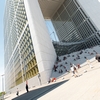 Grande Arche Photo: Tourists and locals relax at the base of the Grande Arche de La Defense in Paris.