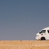 Desert Drive Photo: A tourist van motors along at the Giza pyramids desert in Egypt (ARCHIVED PHOTO on the weekends - originally photographed 2010/10/26).