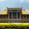 Father Sun Photo: The front of the Sun Yat Sen Memorial Hall building partially reflected in a water fountain.