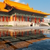 Rain Remains Photo: Taipei's National Concert Hall reflected in a puddle of rain water.