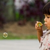 Bubble Boy Photo: A young Indonesian child is busy blowing bubbles at a local park in Bukittinggi, Sumatra (ARCHIVED PHOTO on the weekends - originally photographed 2007/02/05).