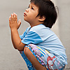 Between Boys Photo: A small boy prays to novice monks on the festival day of Visakha Bhucha in Thailand (ARCHIVED PHOTO on the weekends - originally photographed 2007/05/31).